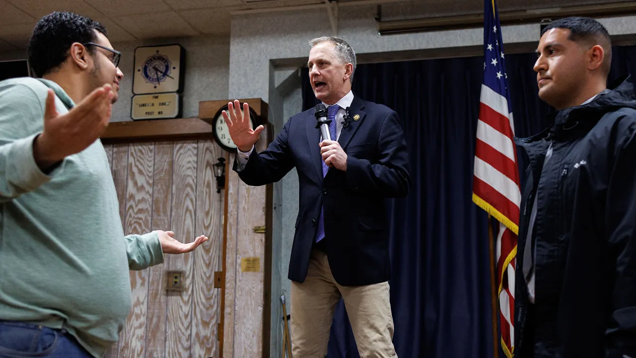 Protesters disrupt, jump on stage during Democrat congressman’s town hall