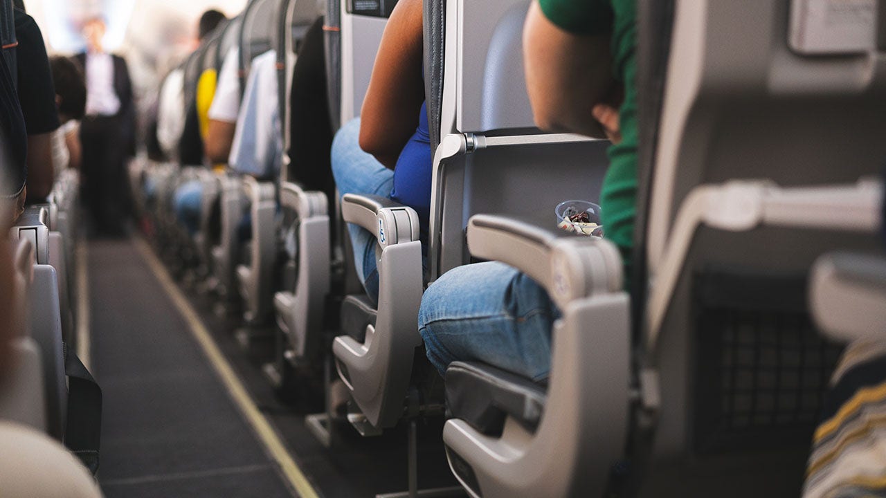 Traveler says fellow passenger kicked her from underneath seat on flight