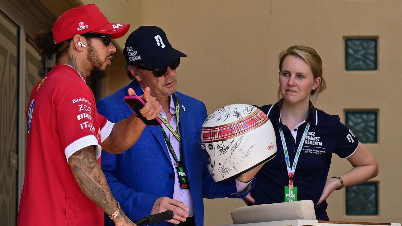 F1 great Michael Schumacher signs helmet for Jackie Stewart’s dementia charity