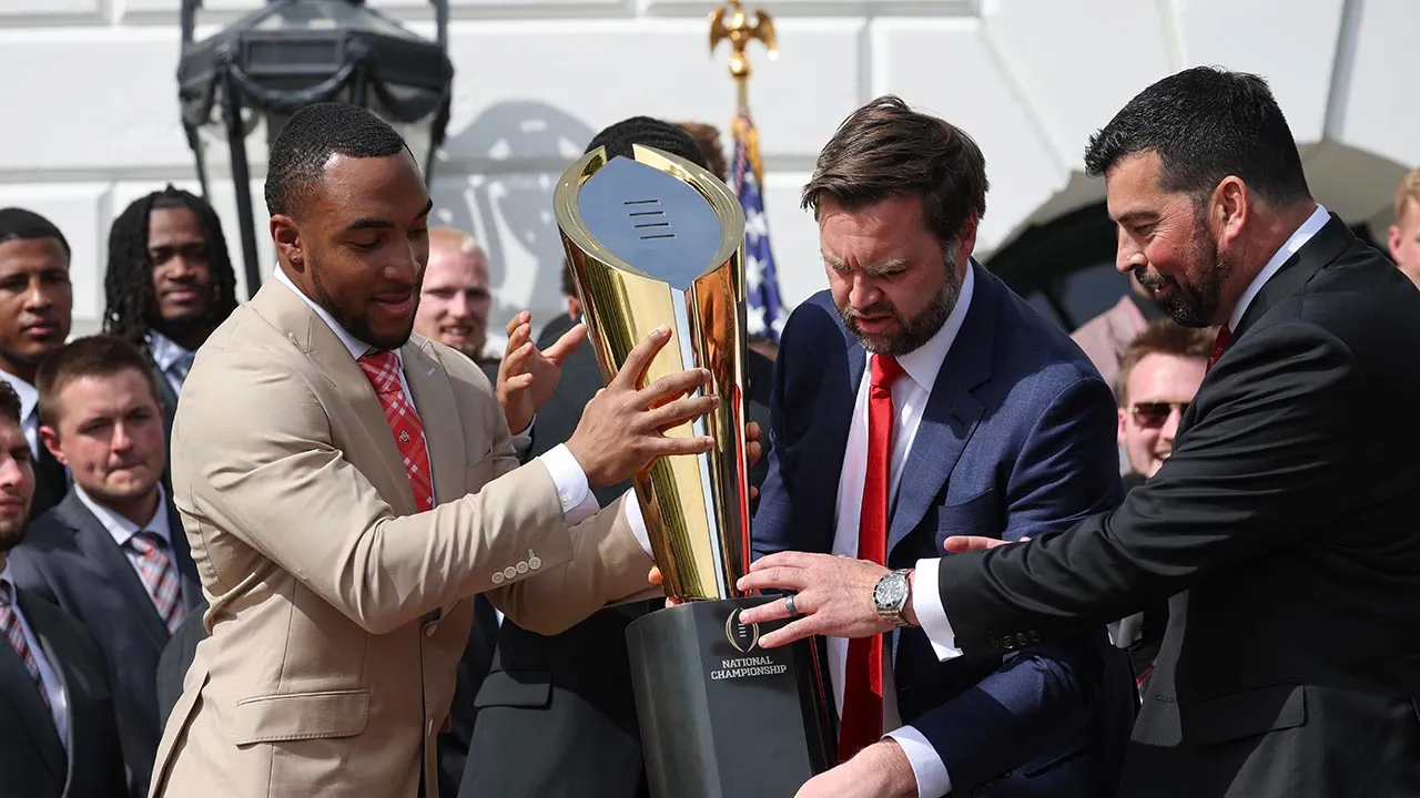 JD Vance nearly fumbles Ohio State’s football trophy at White House