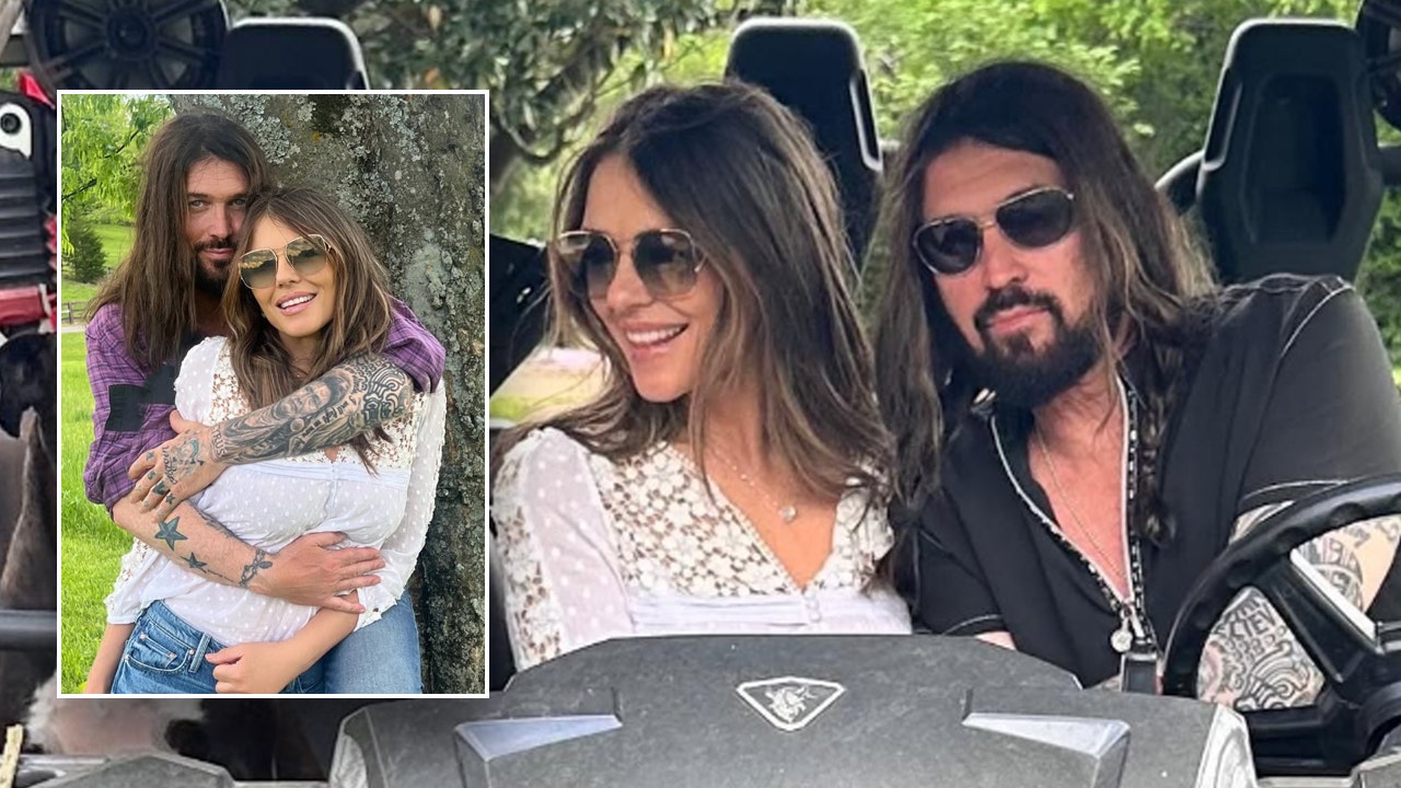 Billy Ray Cyrus cuddles Elizabeth Hurley after launching romantic relationship