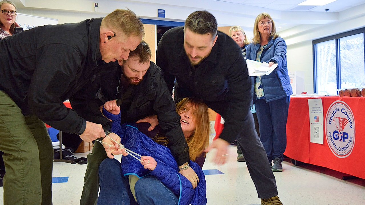 Five men have been charged after woman removed from Idaho town hall