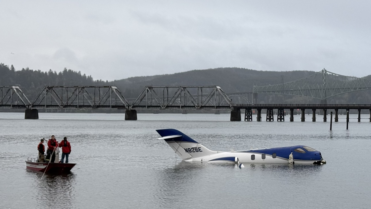 Plane skids off runway into nearby bay after botched landing at Oregon airport