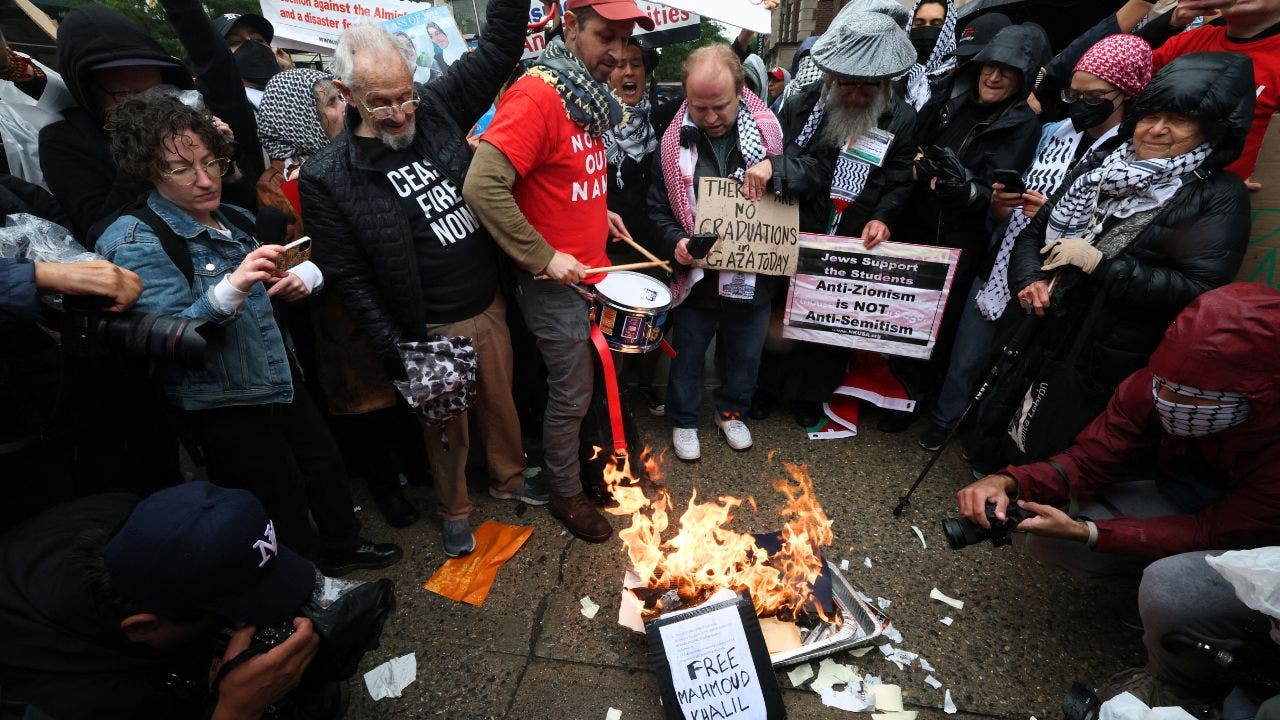 Graduating Columbia University students torch diplomas, clash with police