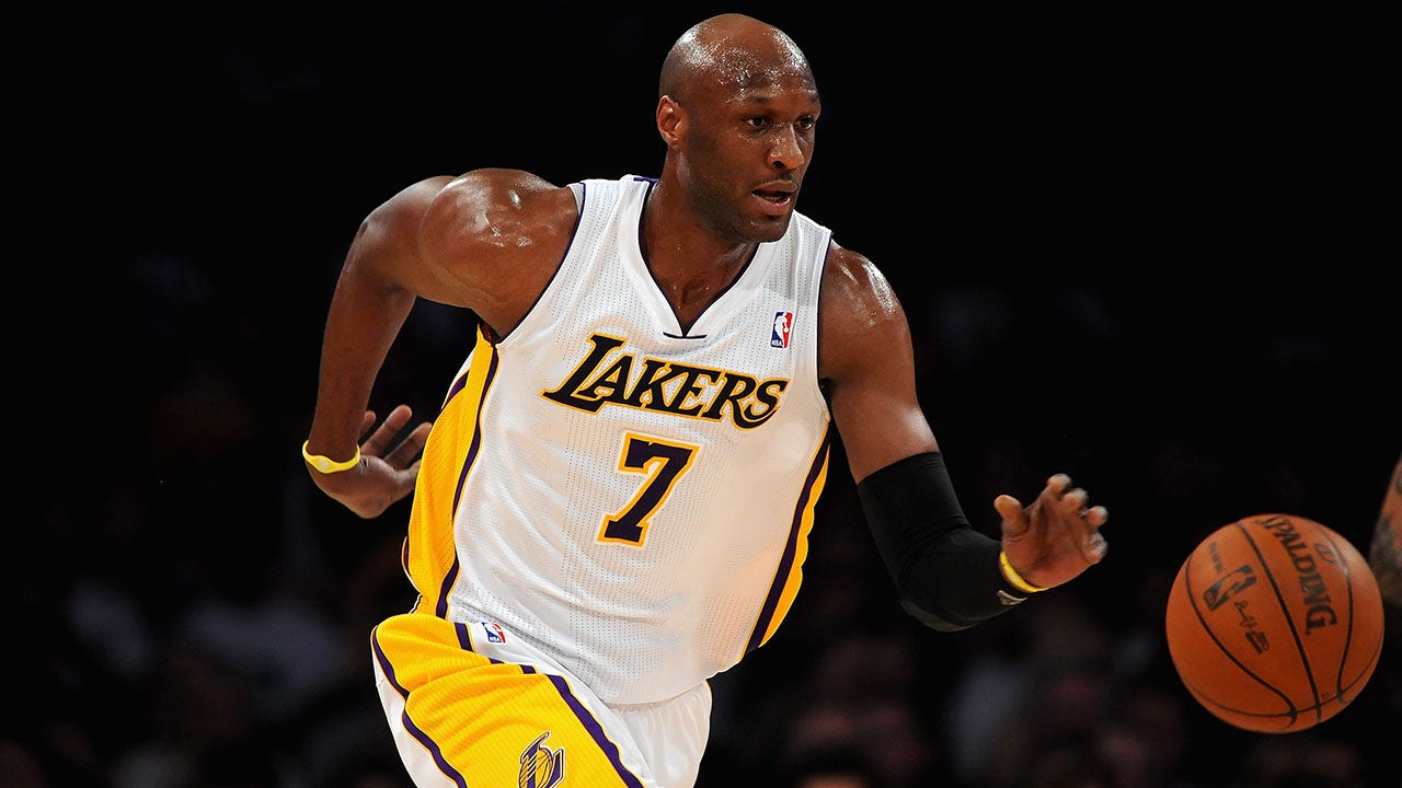 Former NBA champion Odom attends Trump cryptocurrency gala facing protestors