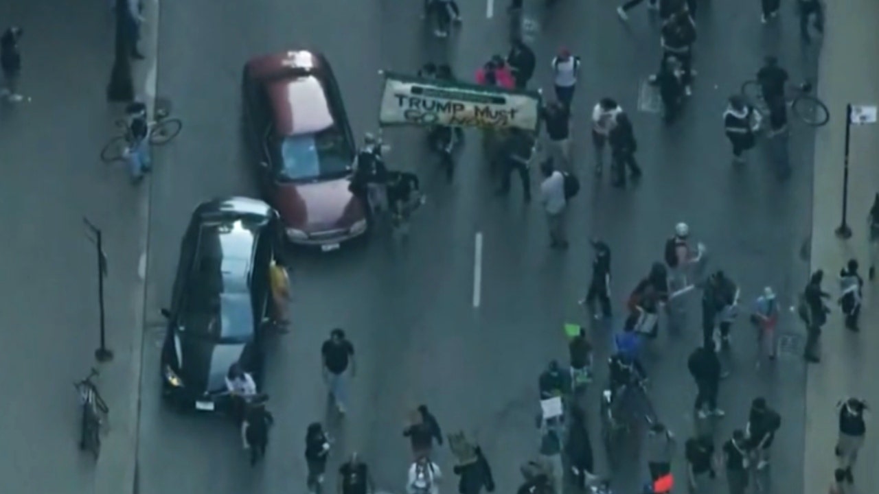 Car drives through anti-ICE protesters in Chicago as demonstrations grow