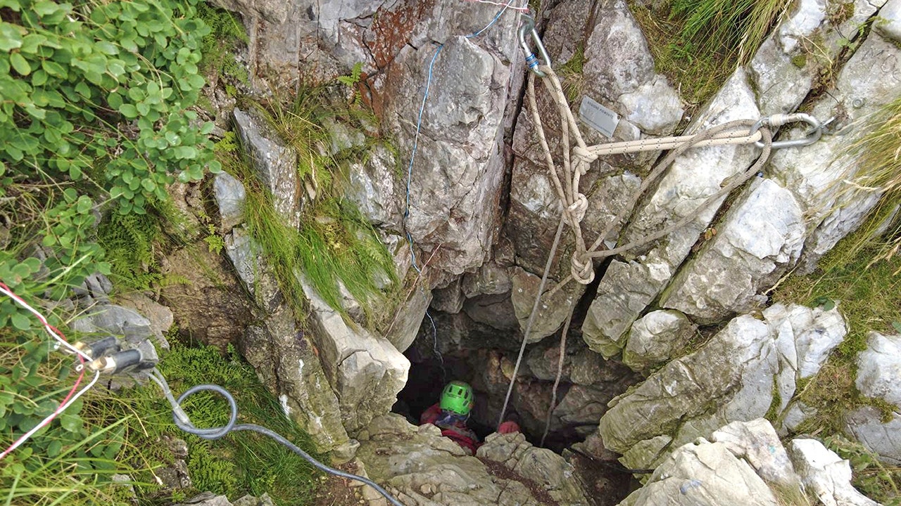 Rescuers use explosives to free trapped and injured explorer from Italian cave