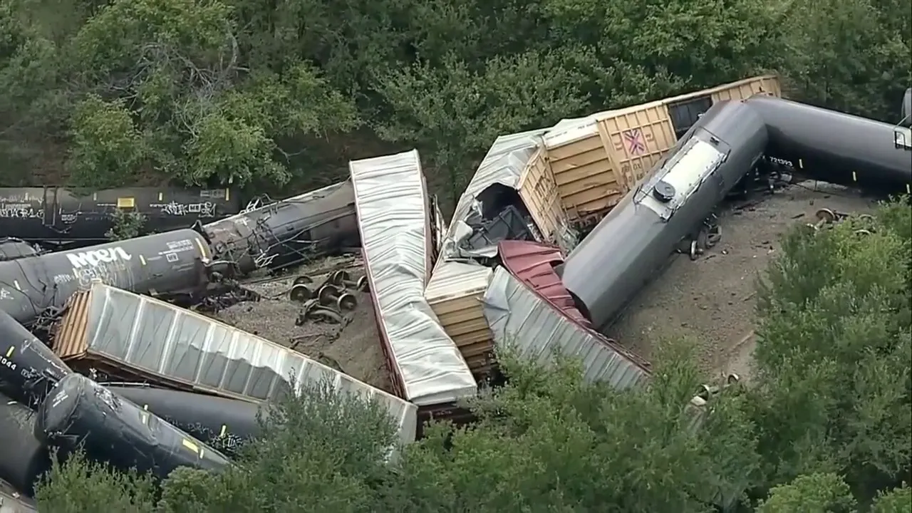 Train derailment involving 35 cars sparks grass fire in Texas