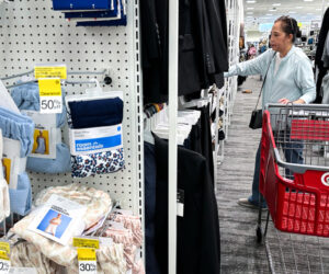 The U.S. economy grew more than thought in the second quarter as glum shoppers kept on buying