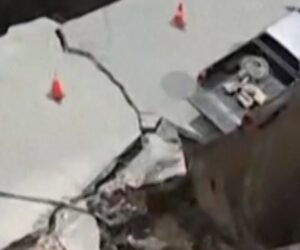 Sinkhole swallows vehicle and electrical poles