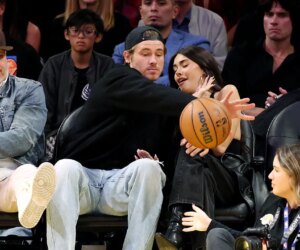Chargers’ Justin Herbert protects Madison Beer from basketball at Lakers game