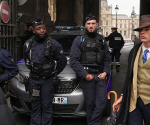 Dapper stranger in Paris crown jewels heist photo sparks online buzz