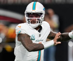 Dolphins’ Tua Tagovailoa battles illness to throw 4 TDs vs Falcons