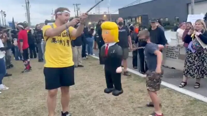 Child at ‘No Kings’ protest stabs at Trump piñata