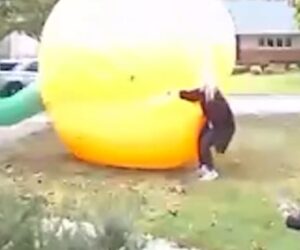 Mom scrambles to control giant inflatable pumpkin