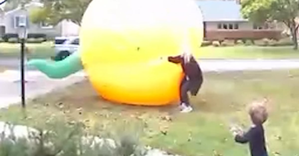 Mom scrambles to control giant inflatable pumpkin