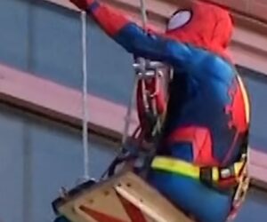 Window washers dress up as superheroes for kids