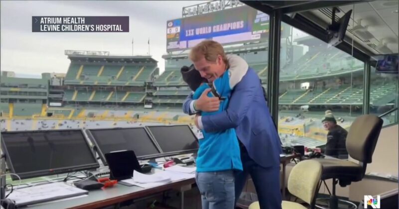 Boy reunites with football hero after heart transplant