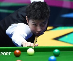 Champion of Champions: Zhao Xintong wins black-ball decider Kyren Wilson to reach semi-finals
