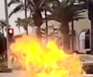 Dirt bike erupts in flames on camera after hitting car