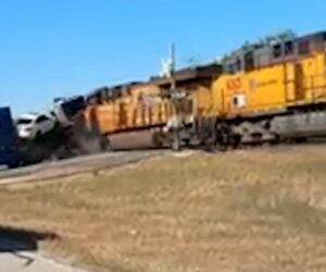 Train collides with truck hauling cars in Texas